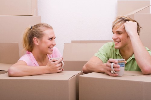Professional house removalists preparing furniture for a Brompton home move