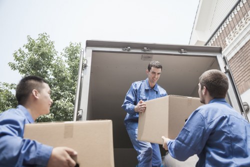 Loading furniture into a removal truck in Brompton