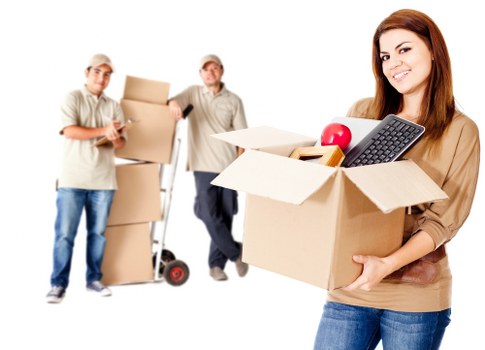 Staff using careful lifting techniques during a removal job