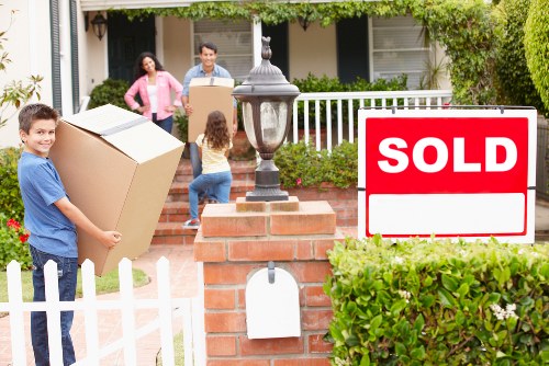 Packing boxes and furniture for a moving truck in Brompton